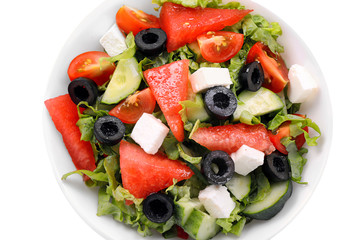 Obraz na płótnie Canvas Bowl with delicious watermelon salad on white background, closeup