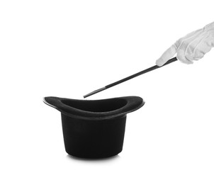 Magician showing trick with hat on white background
