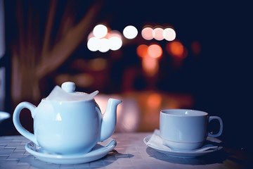 English tea in a cafe / cup and kettle with five o'clock tea