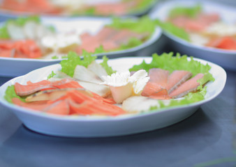 close up.dishes with fish fillet on the kitchen table in the restaurant