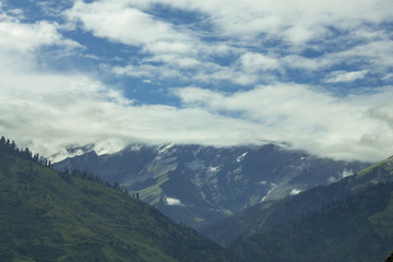 Obraz na płótnie Canvas hills valley with snow mountains