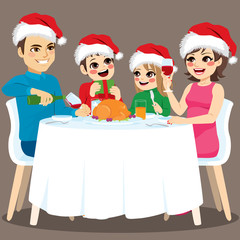 Cute lovely four family members Christmas dinner together happy sitting on round table with food and drink
