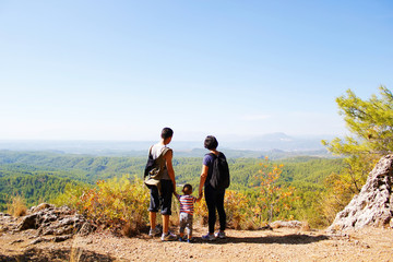 A young family on a journey with a young son