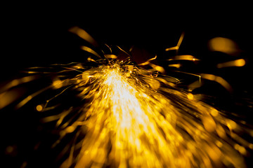 a Eruption of fire sparks on a black background