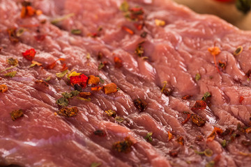 Fresh steak with spices and herbs closeup
