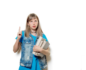 portrait of young teenage girl with books on white background