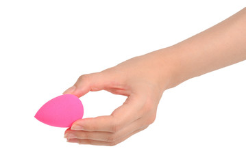 Woman hand holding pink beauty sponge isolated on white.