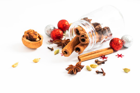 Holiday Food background Christmas spices Star anise, cloves and cadamon pods on white background