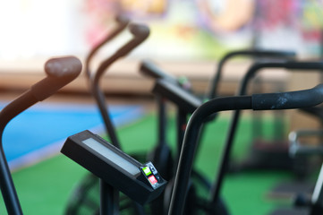 Close-up - air bikes for cardio workout in the crossfit gym. Sports and fitness concept.