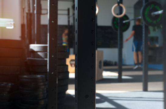 Blurred gym background. Unrecognized people working out in modern fitness center. Fitness and sports.