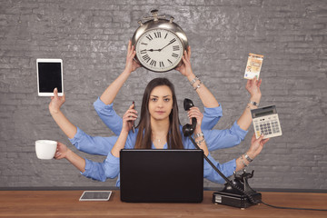 multitask businesswoman sat at the desk in the office, concept of well organized work