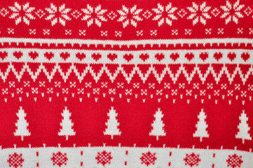 Element decor Christmas red knitted sweater close-up. Holiday gift. Backgdound