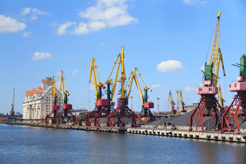 Fototapeta premium Heavy harbour jib cranes in the Kaliningrad Sea Fishing Port.