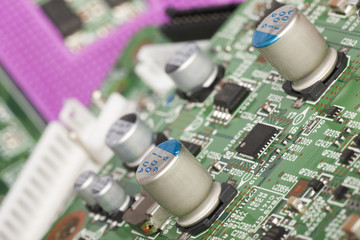 Electronic board. The board features elements: chips, diodes, capacitors, chokes. Shallow depth of...