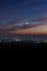 Aerial view on Ivano-Fankivsk city after the sunset with the moon