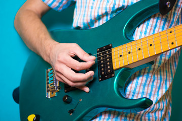 hand with an electric guitar © Medvid