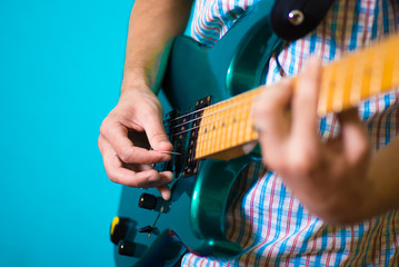 hand with an electric guitar © Medvid