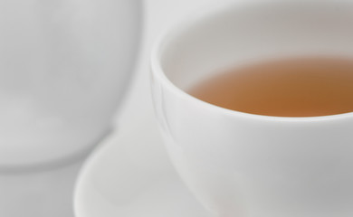 white ceramic cup of tea, macro photography