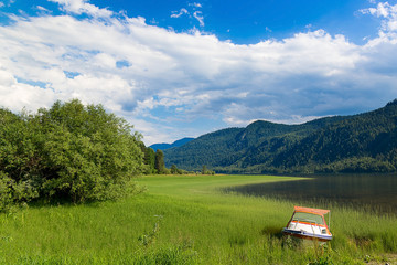 A boat on the shore of Teletskoye Lake