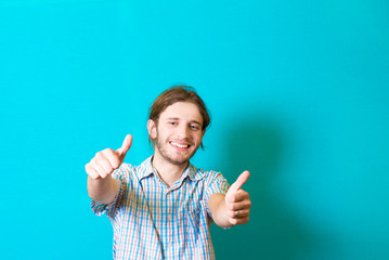 Everything is OK! Happy young man gesturing OK sign and smiling