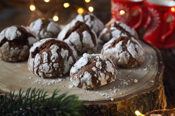 Chocolate Crinkle Cookies  in powdered sugar and Christmas decoration