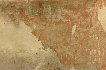 texture of old peeling yellow plaster