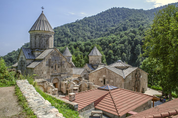 Fototapeta na wymiar Top view of the whole complex of the monastery Haghartsin, located in the mountains and surrounded by forest about the village of gosh, near the town of Dilijan 
