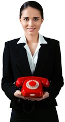 Friendly Businesswoman Holding Corded Phone - Isolated