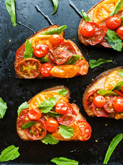 Toasts with tomatoes.