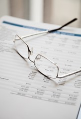 Glasses On Financial Report Close-up