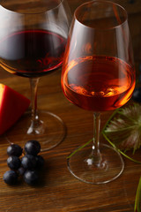 Two winery glasses on wood