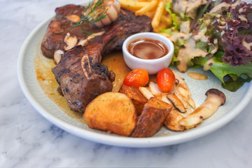 T-Bone steak with fresh vegetable salad