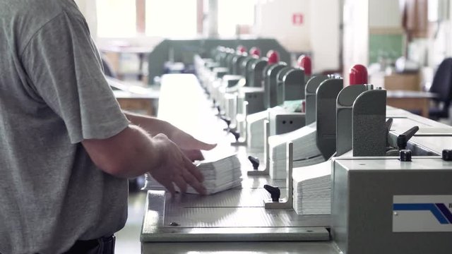 Worker folding typography production