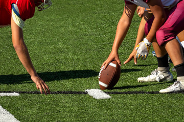 Football Players setting up for the play – Hike the ball 