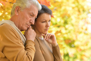 Fototapeta premium Portrait of Sad woman and senior man hugging