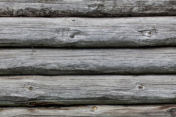 Fototapeta premium Wooden texture of round logs gray grunge texture