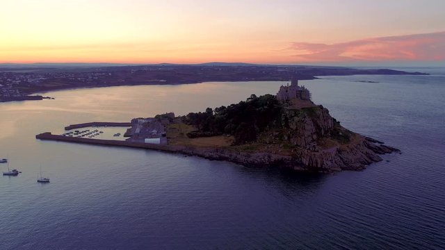 Static mid level drone footage of St Michaels Mount Cornwall at sunrise