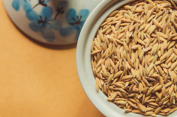 Background and wallpaper by pile of paddy rice and rice seed.