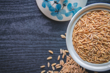 Background and wallpaper by pile of paddy rice and rice seed.