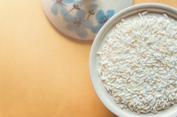 Background and wallpaper by pile of paddy rice and rice seed.