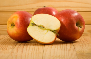 image of red apples on a wooden board