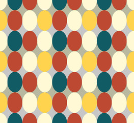 Seamless patter made of retro colored oval abstract geometry shapes in vintage colors of red, tan, blue, yeelow - orange on grey background, Easter egg imitation