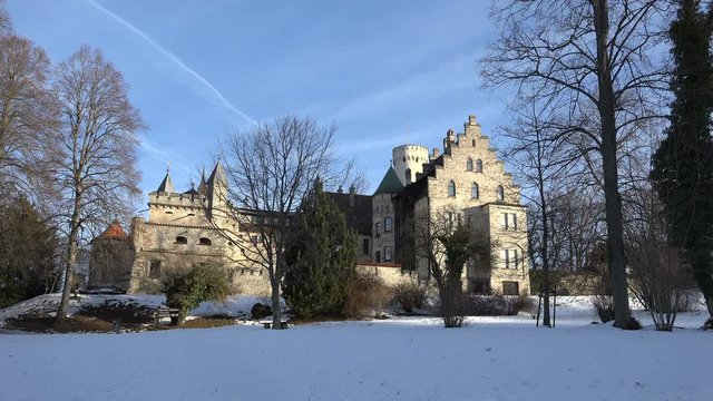 South side view of castle Lichtenstein in Swabia, Germany, bathed in stunningly beautiful early morning light on a cold winter`s day.