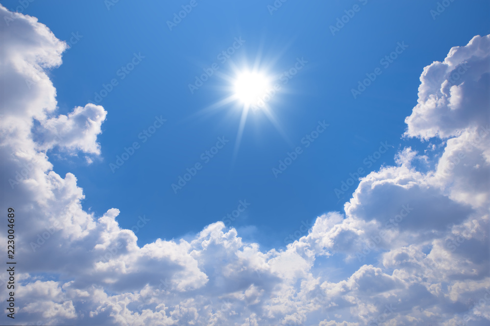 Wall mural blue sky with clouds and sun reflection.the sun shines bright in the daytime in summer