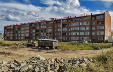Fototapeta premium New apartment building. Kazakhstan (Ust-Kamenogorsk). Modern architecture. New residential area. Residential. Blue sky