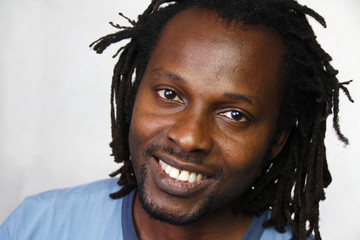 A smiling man showing his pure white teeth