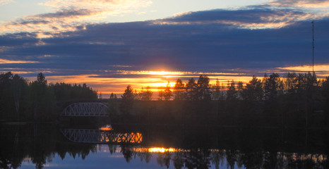 Fototapeta premium beautiful view of a bridge at lake päijänne at sunset
