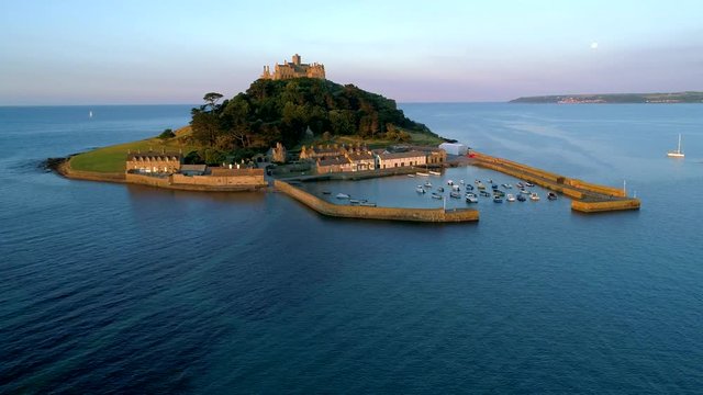 Drone flies around St Michaels Mount Cornwall at dawn