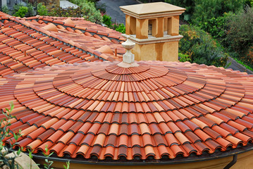 A red tiled roof over a round building in Palos Verdes Estates, California. - Powered by Adobe