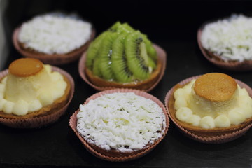 Rich variety of cakes in showcase of typical pastry shop in the street of Barcelona